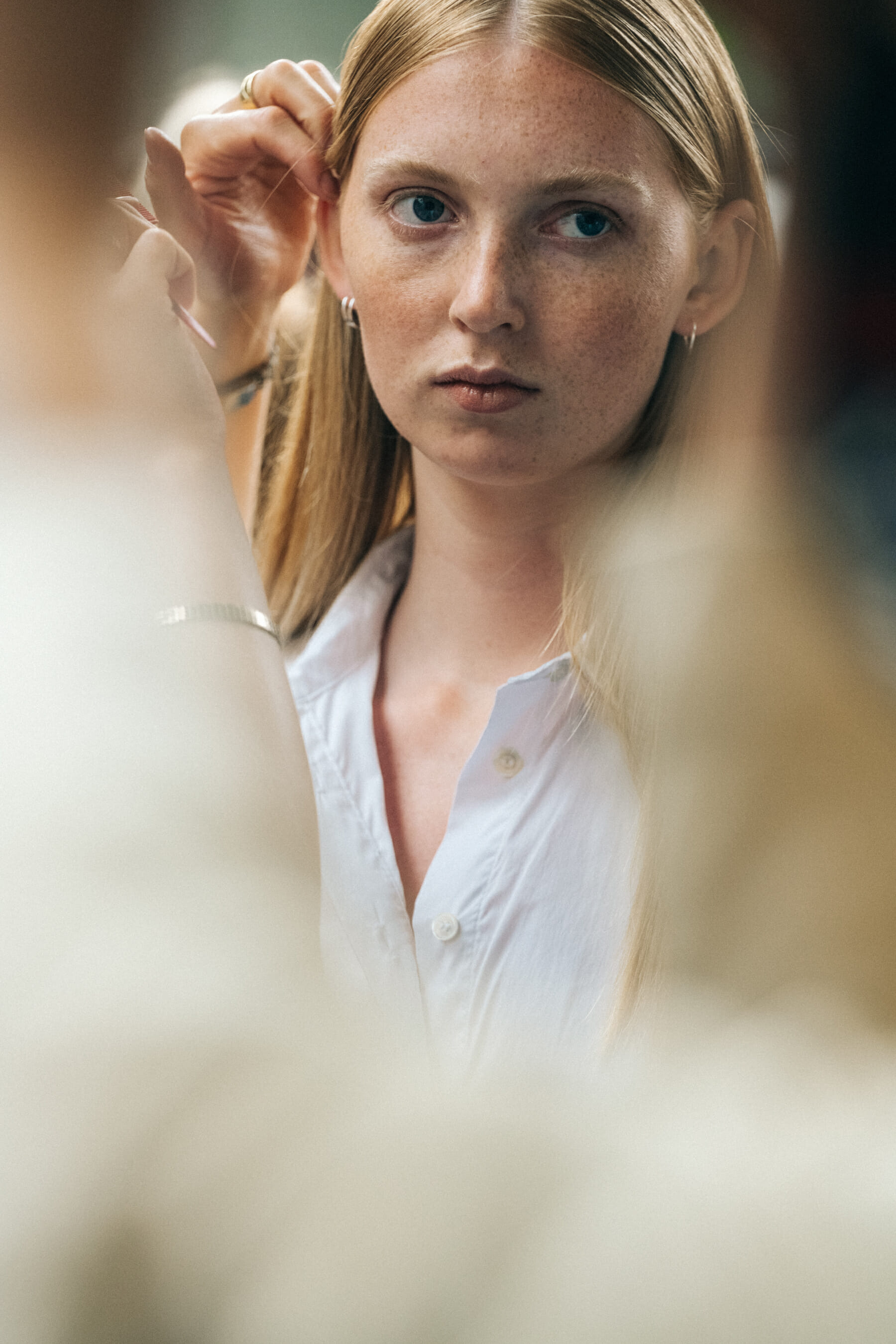 Model backstage wearing white