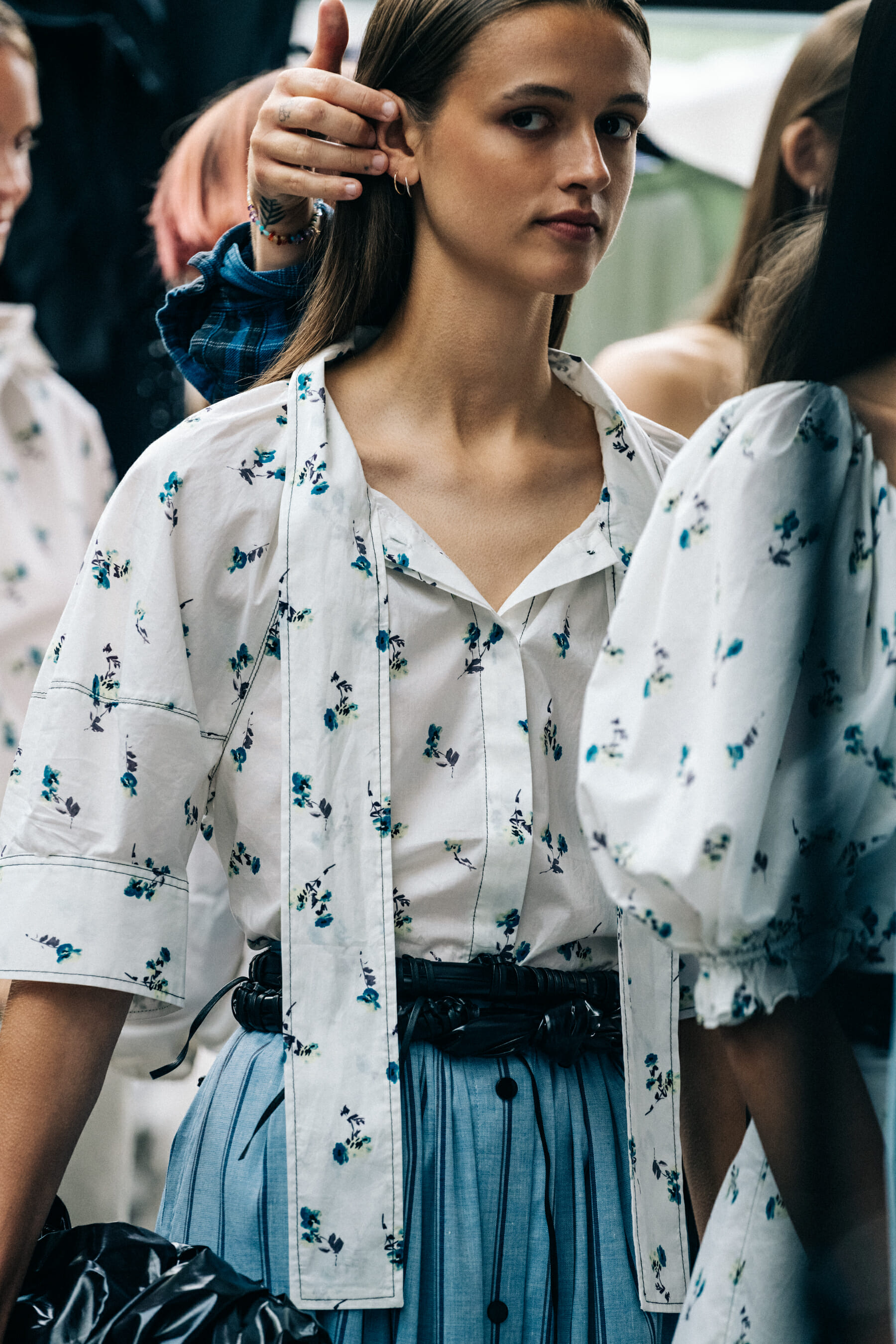 Model backstage wearing white