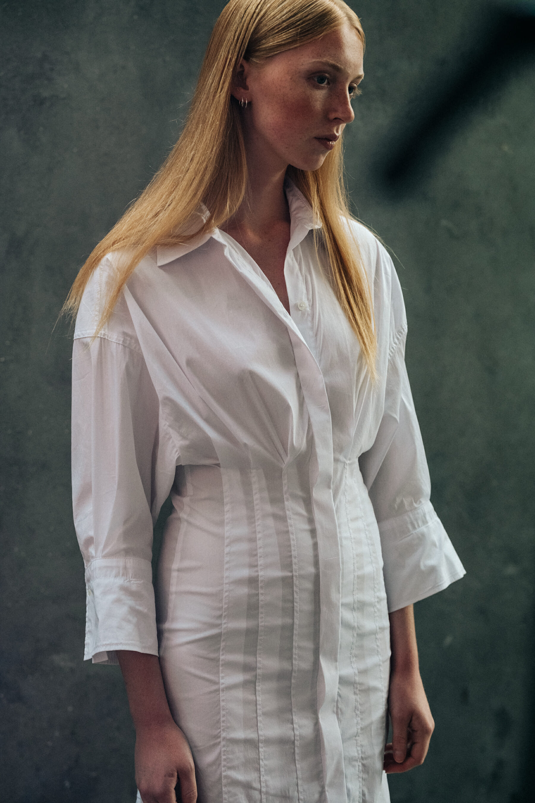 Model backstage wearing white