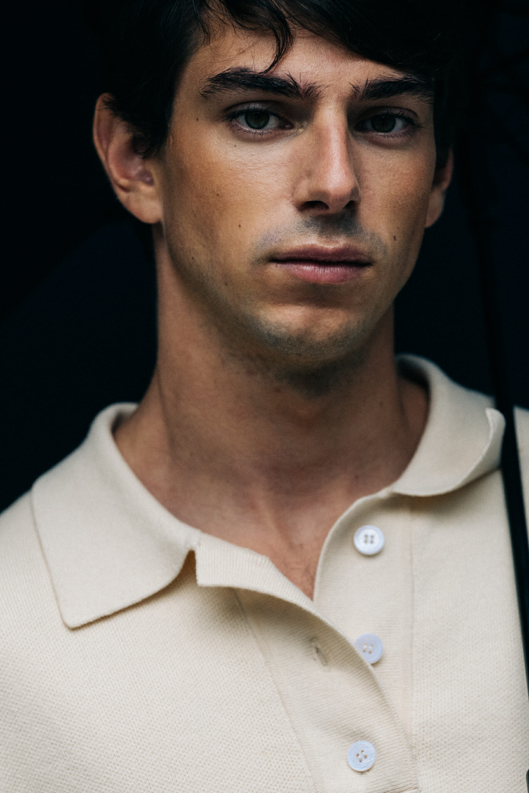 Model with tan shirt