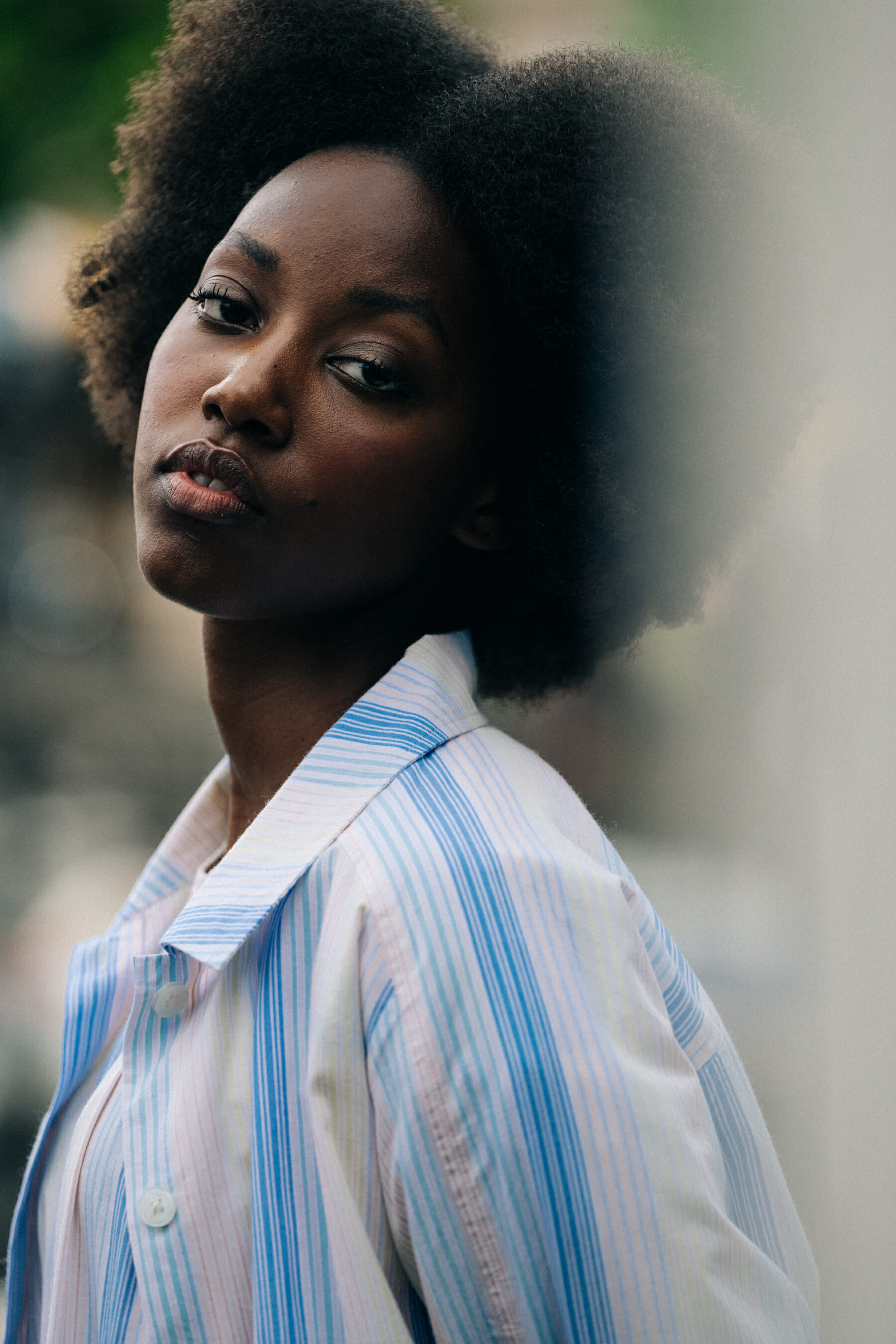 Model with blue and white top