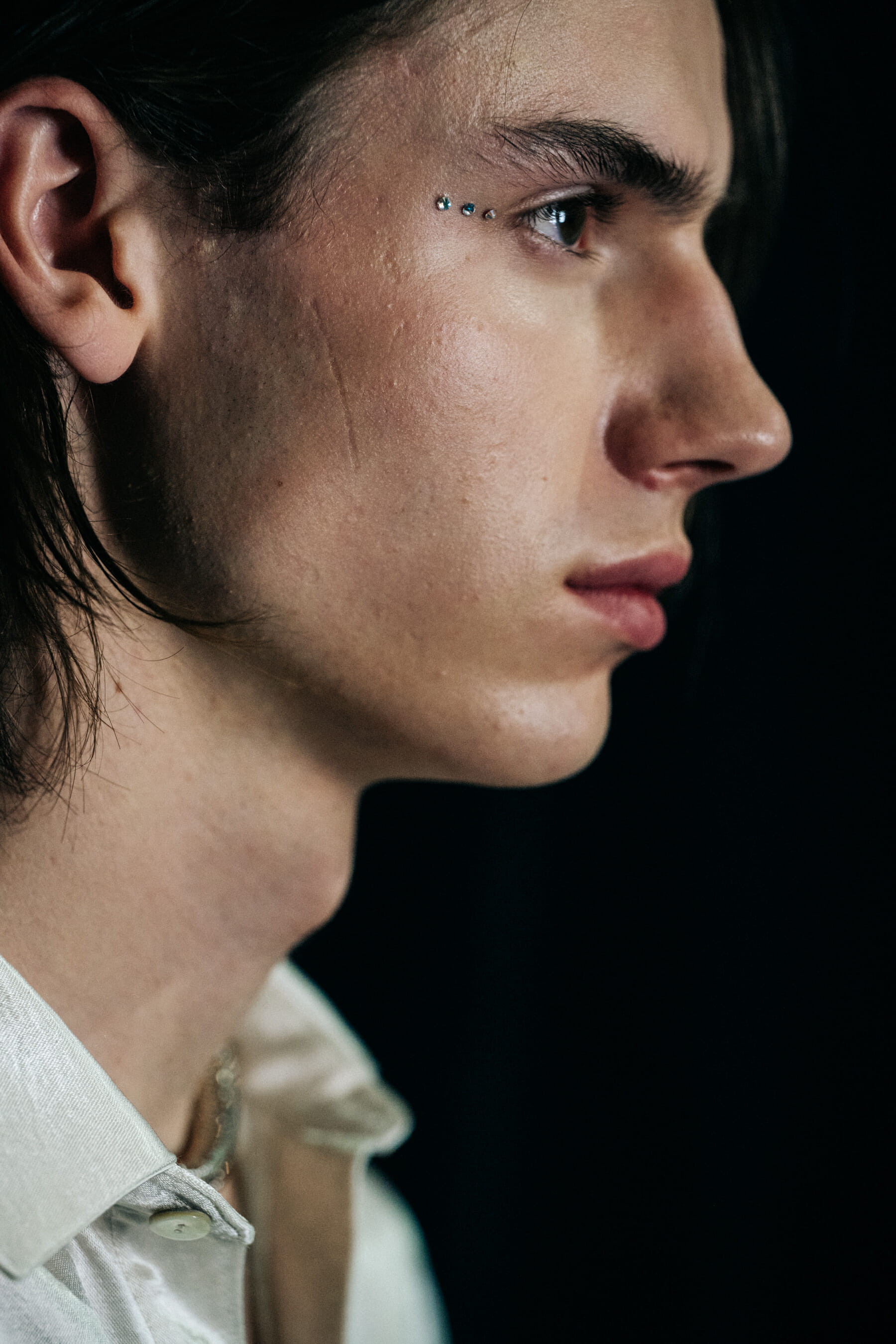Male model eye makeup detail
