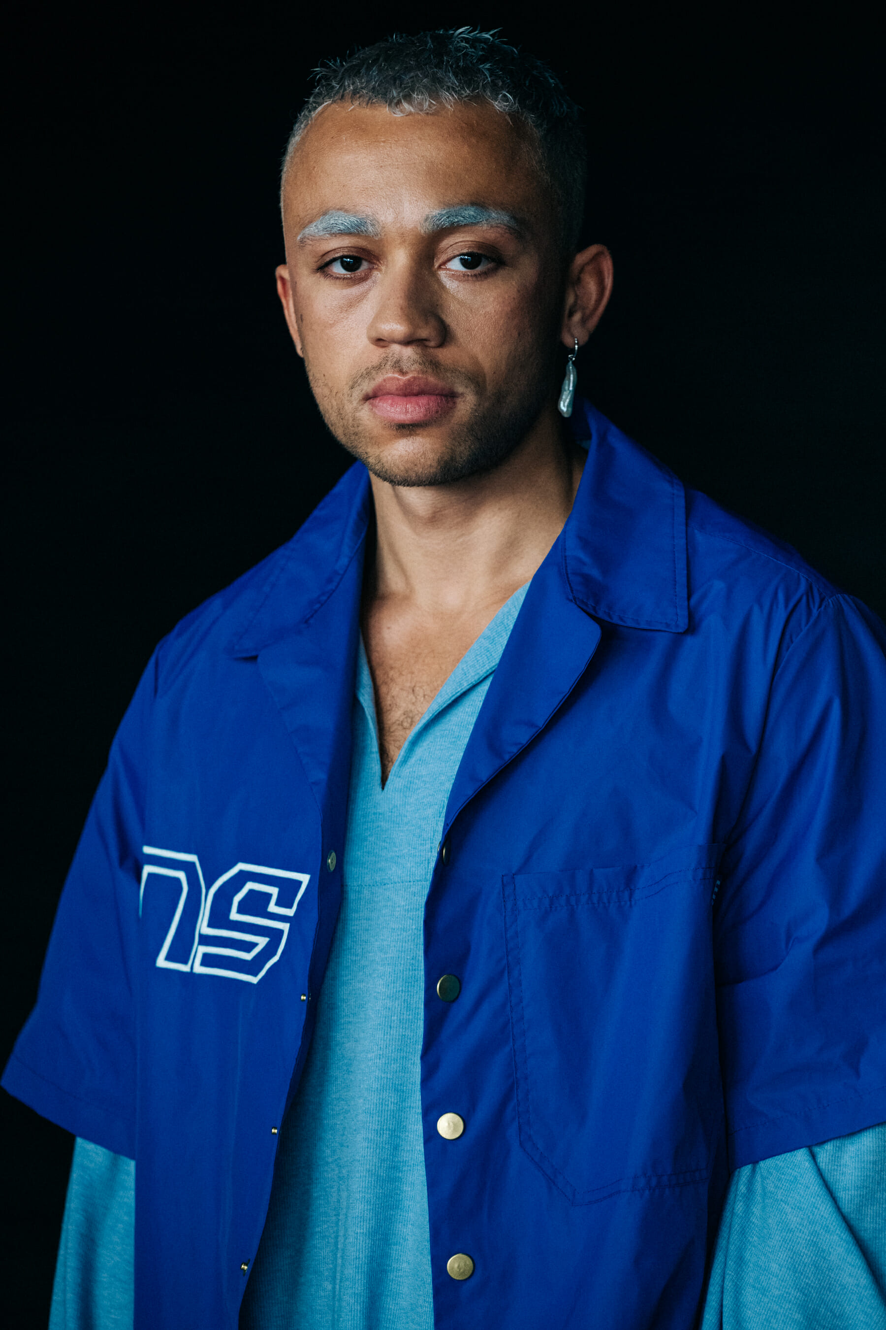 Model backstage wearing blue