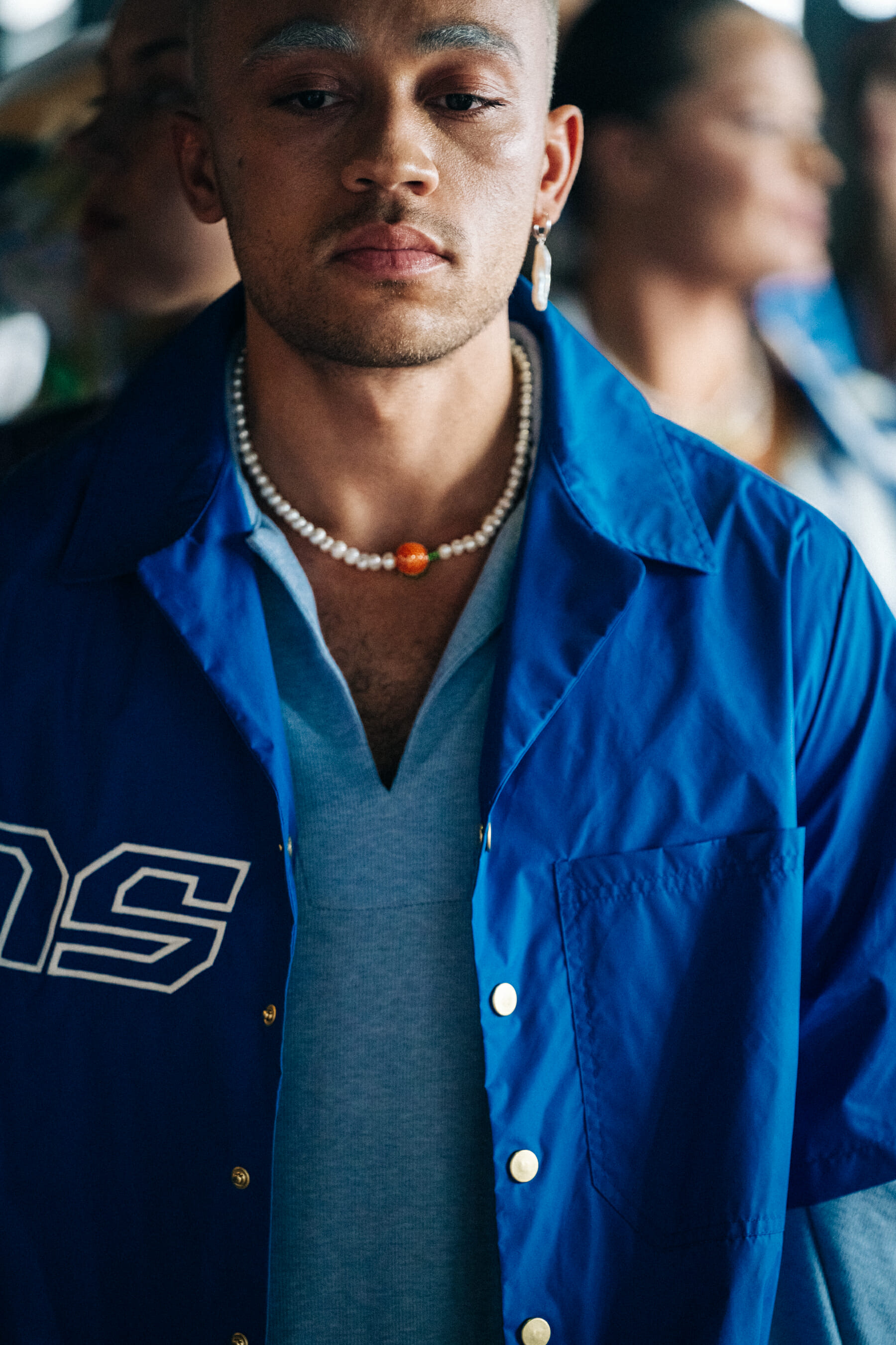 Model backstage wearing blue